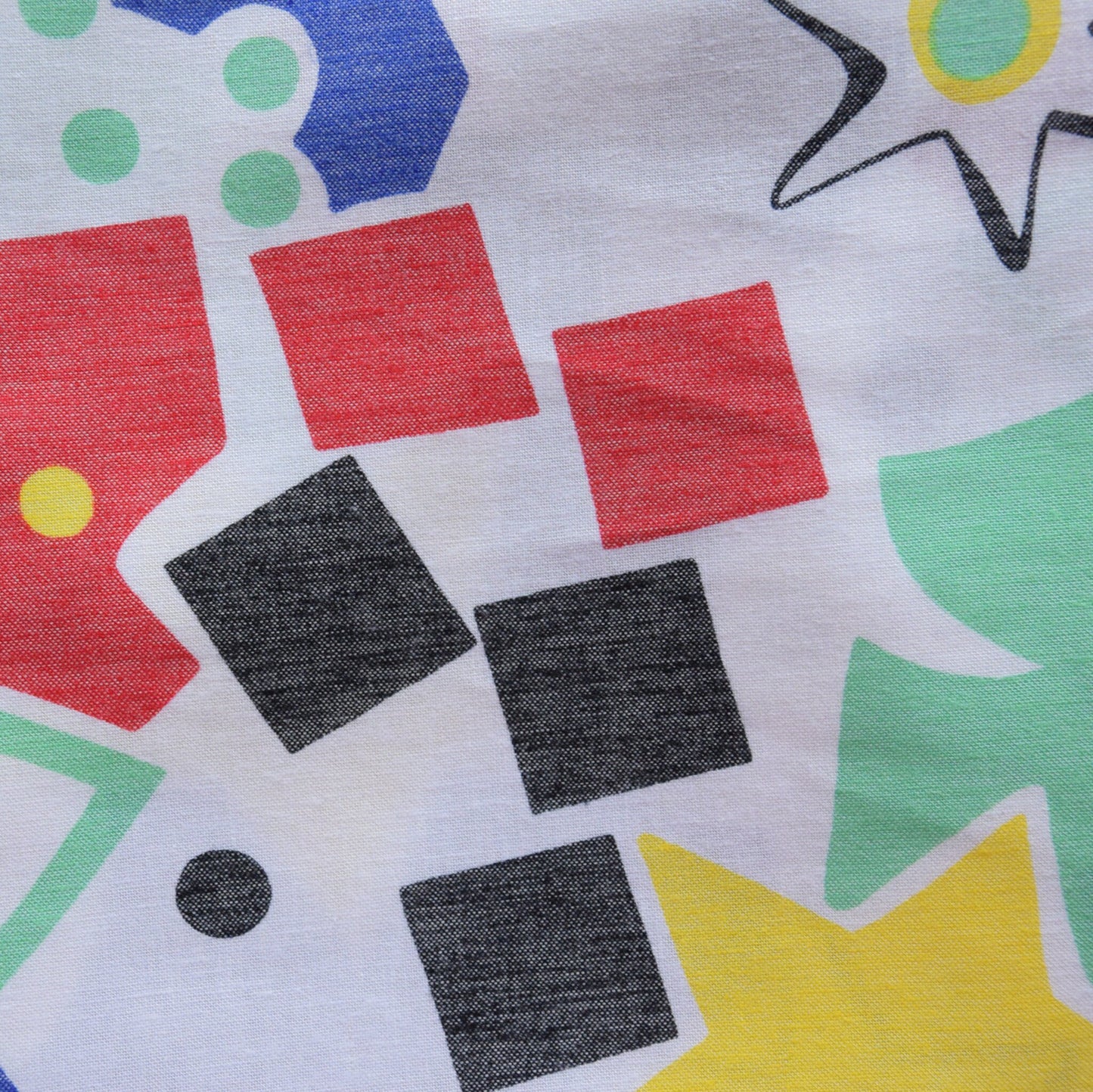 Upcycling cotton fabric with blue, yellow, red, green, black 90's geometric pattern